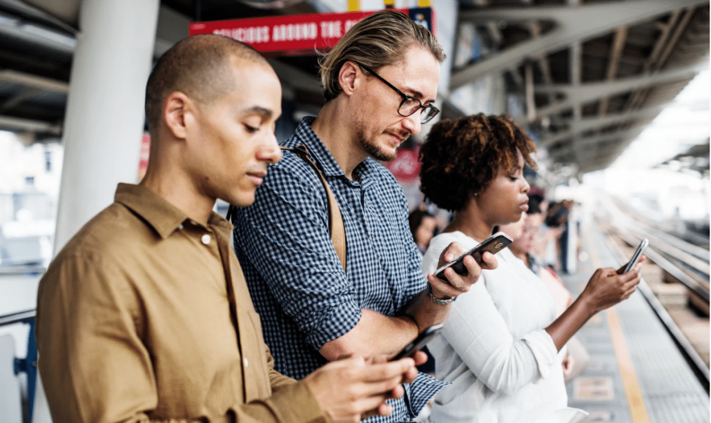 people using phone while waiting